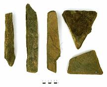 These tools were used at different stages during the quarrying process. The three on the left are chisels and the two on the right are wedges. Fleur de Lys, Newfoundland.
; MUN/Brent Murphy 1997
